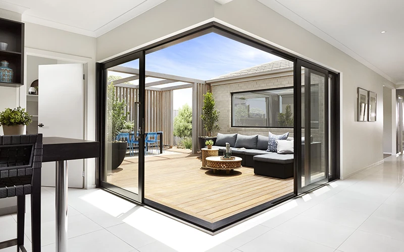 Corner sliding window opening to a timber deck